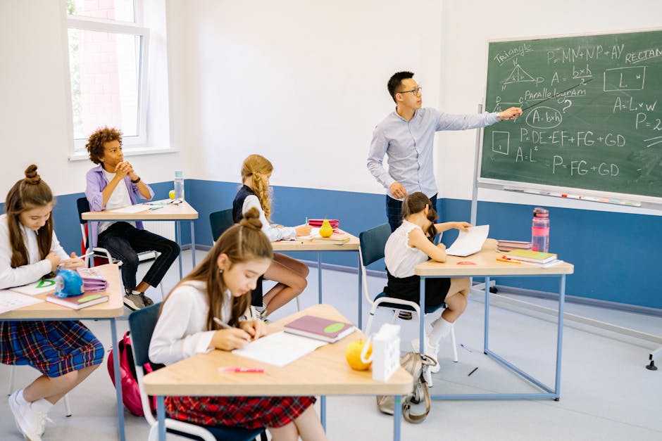 Diverse classroom with teacher discussing mathematics, students engaged in learning